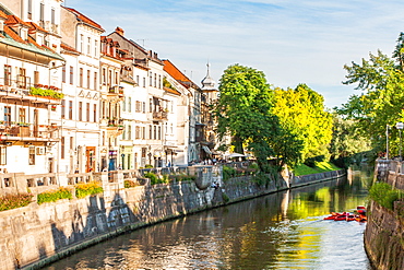 Houses line the Sava River, Ljubljana, Slovenia, Europe