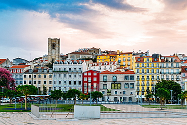 Traditional buildings with azulejo tiles in the old Lisbon neighbourhood of Alfama with Se Cathedral in background, Lisbon, Portugal, Europe