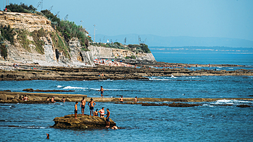 People relax at Avencas beach in Sao Pedro do Estoril near Lisbon, Portugal, Europe