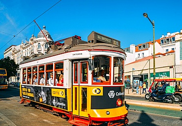 A traditional yellow tram in the Interdente neighbourhood, Lisbon, Portugal, Europe