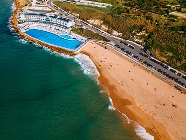 Praia Grande is the largest beach on the Sintra coast, Portugal on an expanse of white sand that delights holidaymakers and also a popular place for surfers. The 100m swimming pool belonging to Arribas Hotel is the largest seawater pool in Europe