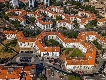 Aerial drone view of geometric Soviet-era apartment blocks in Carnaxide district in Lisbon, Portugal