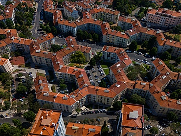 Aerial drone view of geometric Soviet-era apartment blocks in Carnaxide district in Lisbon, Portugal