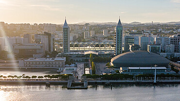 Aerial drone view of Oriente Train station and general view of Parque das Nacoes in Lisbon, Portugal at sunset
