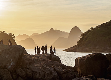 View over rocks of Piratininga towards Rio de Janeiro, sunset, Niteroi, State of Rio de Janeiro, Brazil, South America