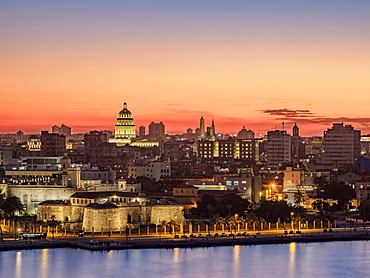 View over Castle of the Royal Force (Castillo de la Real Fuerza) and Habana Vieja towards El Capitolio at dusk, UNESCO World Heritage Site, Havana, La Habana Province, Cuba, West Indies, Central America