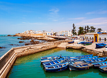 Cityscape with blue boats in the Scala Harbour and the Medina city walls, Essaouira, Marrakesh-Safi Region, Morocco, North Africa, Africa