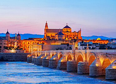 View over Roman Bridge of Cordoba and Guadalquivir River towards the Mosque Cathedral, dusk, UNESCO World Heritage Site, Cordoba, Andalusia, Spain, Europe