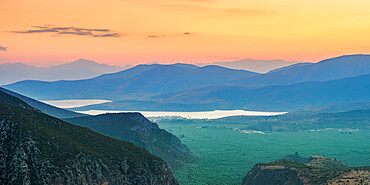 View over the Pleistos River Valley towards the Gulf of Corinth at dusk, Delphi, Phocis, Greece, Europe