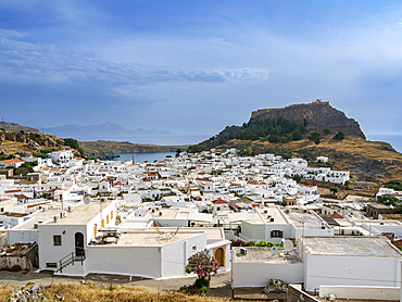 View over Lindos village towards the Acropolis, Rhodes Island, Dodecanese, Greek Islands, Greece, Europe