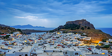 View over Lindos village towards the Acropolis at dawn, Rhodes Island, Dodecanese, Greek Islands, Greece, Europe