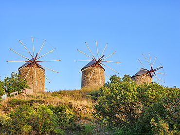 Windmills of Patmos Chora at sunset, Patmos Island, Dodecanese, Greek Islands, Greece, Europe