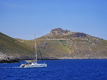 Sailboat off the coast and Medieval Castle of Pandeli, Leros Island, Dodecanese, Greek Islands, Greece, Europe