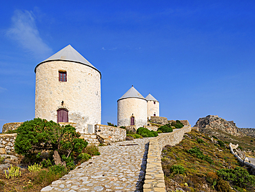 Windmills of Pandeli with Medieval Castle in the background, Leros Island, Dodecanese, Greek Islands, Greece, Europe