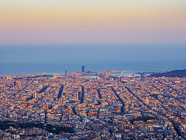 Cityscape at sunset seen from Mount Tibidabo, Barcelona, Catalonia, Spain, Europe