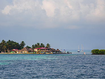 View towards The Lazy Lizard Bar and The Split at sunrise, Caye Caulker, Belize District, Belize
