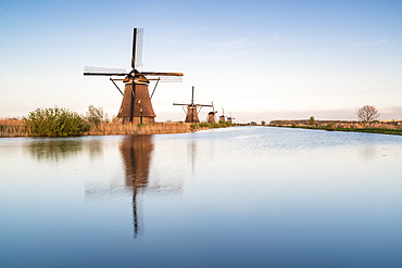 Windmills in a row on the canal, Kinderdijk, UNESCO World Heritage Site, Molenwaard municipality, South Holland province, Netherlands, Europe