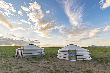 Mongolian nomadic traditional gers and clouds in the sky, Middle Gobi province, Mongolia, Central Asia, Asia