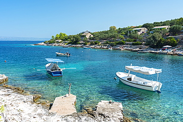 Boats at the little pier of Tankaraca cove in summer, Vela Luka, Korcula island, Dubrovnik-Neretva county, Croatia, Europe