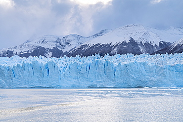 Southern terminus of Perito Moreno glacier under a moody sky, Los Glaciares National Park, UNESCO World Heritage Site, Santa Cruz, Argentina, South America