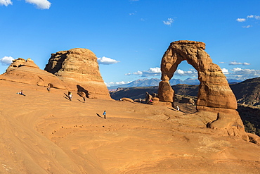 Peoples at Delicate Arch at golden hour, Arches National Park, Moab, Grand County, Utah, United States of America, North America