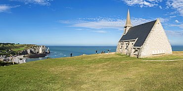 Notre-Dame de la Garde chapel and Porte d'Aval in the background, Etretat, Normandy, France, Europe