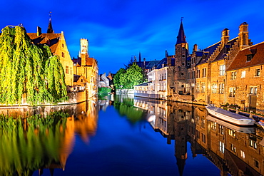 The beautiful buildings of Bruges reflected in the still waters of the canal, UNESCO World Heritage Site, Bruges, Belgium, Europe