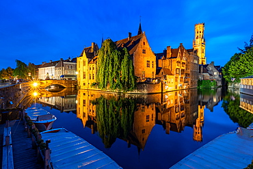 The beautiful buildings of Bruges reflected in the still waters of the canal, UNESCO World Heritage Site, Bruges, Belgium, Europe