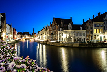 An evening blue hour scene along the canals of Bruges, Belgium, Europe