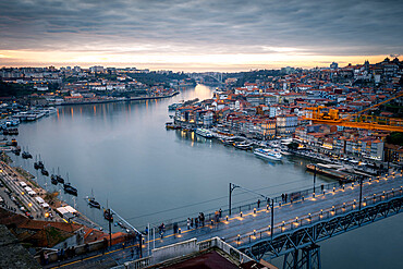 Sunset over Porto looking towards the Ribeira district and Dom Luis I Bridge over the River Douro, Porto, Portugal, Europe