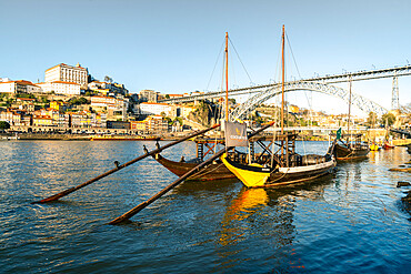 Boats of the Port Bodegas on the Douro River looking towards the Ribeira district of Porto, Portugal, Europe