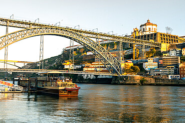 The Dom Luis I Bridge at sunset looking towards the Monastery of Serra do Pilar, UNESCO World Heritage Site, Porto, Portugal, Europe