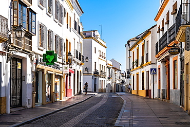 The white and yellow buildings of a typical Andalusian street in Cordoba, Andalusia, Spain, Europe