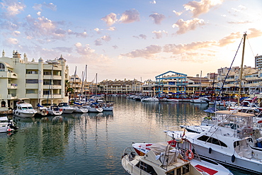 Benalmadena's Puerto Marina at sunset sitting between the Costa Del Sol beach resorts of Benalmadena and Torremolinos, Andalusia, Spain, Europe