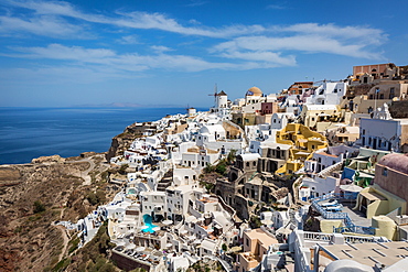 Day time view over the whitewashed buildings and windmill of Oia from the castle walls, Santorini, Cyclades, Greek Islands, Greece, Europe