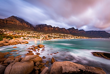 Long exposure at sunset at Camps Bay with cloud over Table Mountain and the Twelve Apostles, Cape Town, South Africa, Africa