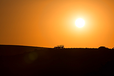 Sundowners at sunset over a South African Game Reserve, Eastern Cape, South Africa, Africa