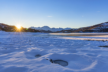 Campotosto Lake in winter at sunrise, Gran Sasso National Park, Abruzzo, Italy, Europe