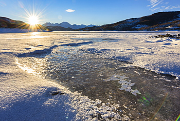 Lake Campotosto at sunrise in winter, Gran Sasso National Park, Abruzzo, Italy, Europe