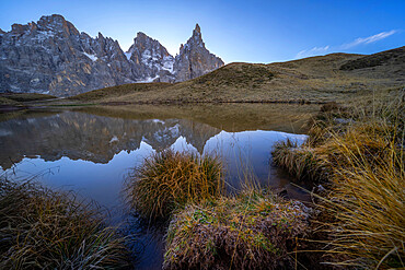 Cimon della Pala reflected in a lake, Rolle Pass, Dolomites, Trentino, Italy, Europe