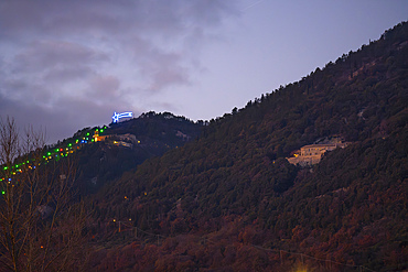 Italy, Umbria, Gubbio, St. Girolamo monastery at sunset during Christmas time