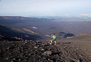 hiker trekking on mount Etna