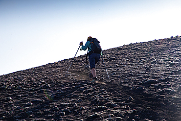 hiker trekking on mount Etna
