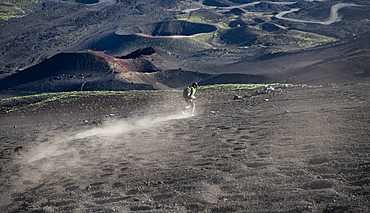 hiker trekking on mount Etna