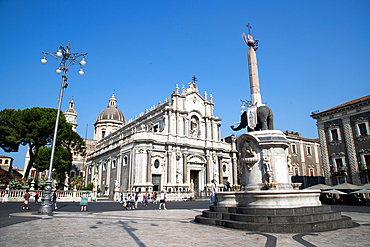 cityscape image of Duomo Square in Catania, Sicily with Cathedral of Saint Agatha at sunrise