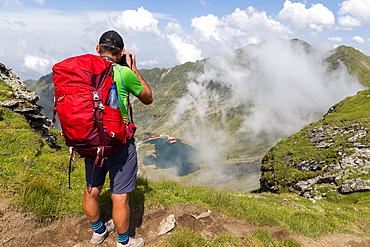 trekking with a dog in hogh mountains