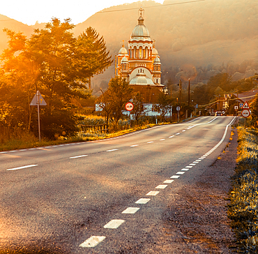 road and church in golden hour