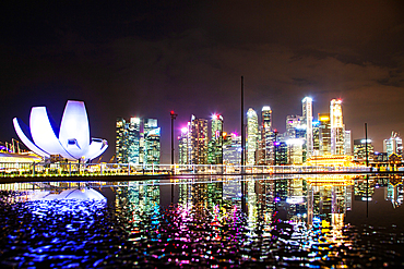 SINGAPORE, SINGAPORE - MARCH 2019: skyline of Singapore Marina Bay at night downtown core skyscrapers and the Art Science museum