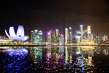 SINGAPORE, SINGAPORE - MARCH 2019: skyline of Singapore Marina Bay at night downtown core skyscrapers and the Art Science museum