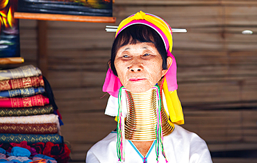 Long neck karen or Kayan woman in Baan Tong Luang eco village near Chiangmai,Thailand. They fled the war in Myanmar and now live in villages across northern Thailand selling their handicraft to tourists.